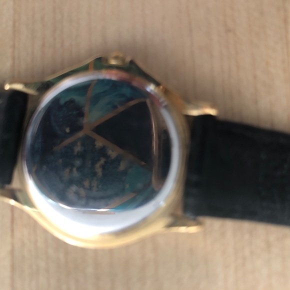 Women’s classic Movado gold tone face w black leather strap used